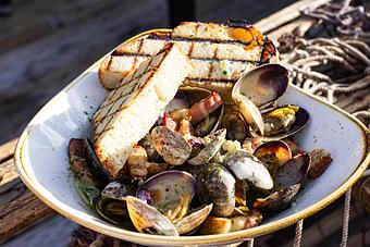 Product: Steamed Manila Clams - Salty's on Alki in Alki Beach, West Seattle - Seattle, WA American Restaurants
