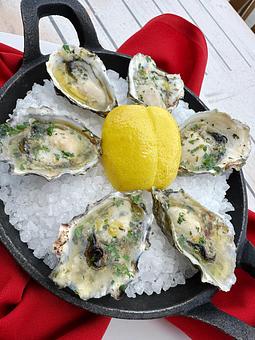 Product: Baked Oyster “Scampi” - Salty's on Alki in Alki Beach, West Seattle - Seattle, WA American Restaurants