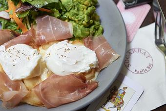 Product: JAMÓN & MANCHEGO “BROKEN EGGS” | two fried eggs, jamón serrano, manchego cheese, crispy wedged potatoes - Socarrat Paella Bar - Chelsea in Chelsea - New York, NY Spanish Restaurants