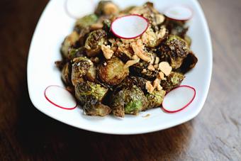 Product: COLES DE BRUSELAS | crispy brussels sprouts, chopped almonds, sweet and spice glaze - Socarrat Paella Bar - Chelsea in Chelsea - New York, NY Spanish Restaurants