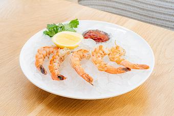 Product: 5 shrimp on a bed of crushed ice served with a side of spicy cocktail sauce and a lemon and parsley. - Summer House - Las Vegas in Las Vegas, NV Restaurants/Food & Dining