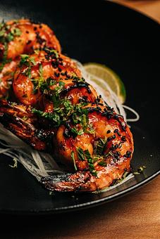 Product: 5 pieces of oishii jumbo shrimp are marinated in a sweet and spicy honey gochujang sauce before being grilled over binchotan charcoal. finished with black sesame seeds and lime zest. - Sushi San - Reservations in River North - Chicago, IL Japanese Restaurants