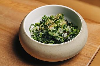 Product: refreshing and flavorful wakame seaweed salad dressed in jalapeno soy and topped with cucumber, lotus root, sesame seed, and green onion - Sushi San - Reservations in River North - Chicago, IL Japanese Restaurants