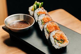 Product: faroe island salmon mixed with yuzu and spicy korean gochujang is rolled with cucumber, jalapeño, chives, and a bit of tempura crunch. served with side of wasabi soy. available in 5 or 10 pieces. - Sushi San - Reservations in River North - Chicago, IL Japanese Restaurants
