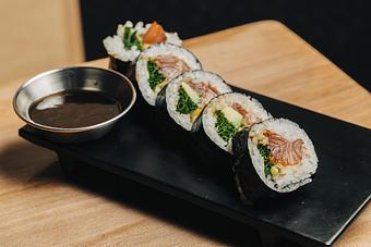 Product: zuke marinated salmon is dressed with gomae dressing and rolled with avocado, chives and a thin slice of meyer lemon. available in 5 or 10 pieces. - Sushi San - Reservations in River North - Chicago, IL Japanese Restaurants