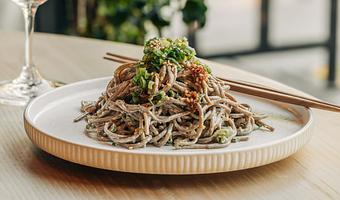 Product: chilled japanese buckwheat noodles tossed in gomae dressing and finished with garlic chili vinaigrette and negi. - Sushi San - Reservations in River North - Chicago, IL Japanese Restaurants