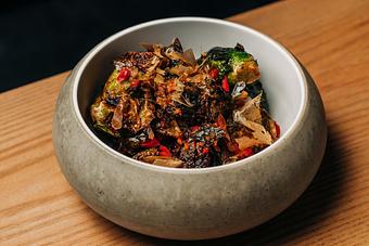 Product: flash fried brussel sprouts tossed with carrot ginger vinaigrette and topped with sesame seed and bonito flake - Sushi San - Reservations in River North - Chicago, IL Japanese Restaurants