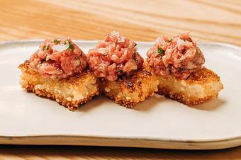 Product: crispy pressed rice topped with chopped ohba leaf, chopped wagyu, chive, salt, and toasted sesame seeds. - Sushi San - Reservations in River North - Chicago, IL Japanese Restaurants