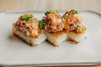 Product: 3 pieces. crispy pressed rice, griddled and topped with spicy tuna, sesame, and green onion. - Sushi San - Reservations in River North - Chicago, IL Japanese Restaurants