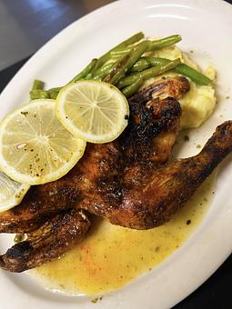 Product: Served with mashed potatoes and green beans in a lemon-caper sauce. - The Bowman in Parkville, MD American Restaurants