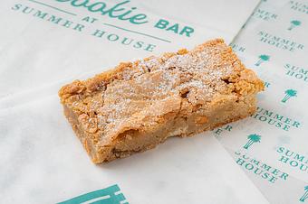 Product: Rectangular blondie topped with powdered sugar. - The Cookie Bar by Summer House in Chicago, IL Restaurants/Food & Dining
