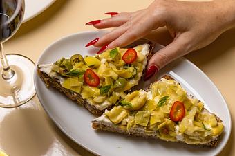 Product: Artichoke Toast at The Django with fresh ricotta, basil, olive oil, and multigrain toast. - The Django in TriBeCa - New York, NY American Restaurants