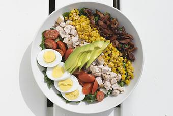 Product: Our fresh Cobb Salad... greens, grilled chicken, avocado, corn, tomato, bacon, egg, buttermilk dressing (GF) - The Shed Restaurant- Plainview in The Shops at Country Pointe Beechwood - Plainview, NY American Restaurants