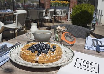 Product: The Belgian Waffles served with hot coffee - The Shed Restaurant- Plainview in The Shops at Country Pointe Beechwood - Plainview, NY American Restaurants