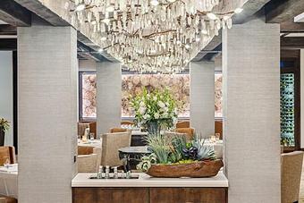 Product: A honed-crystal chandelier runs through the center of the Dining Room at TRIBUTE restaurant. - TRIBUTE at The Houstonian in Memorial - Houston, TX American Restaurants