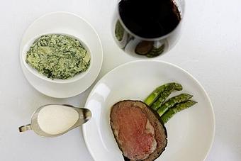 Product: Prime Rib Fridays! Each Friday, TRIBUTE chefs rise early to smoke Painted Hills Natural Beef to perfection. It is served with red wine au jus, Yukon gold mashed potatoes, grilled jumbo asparagus, creamed spinach, and house-made horseradish sauce for $89. - TRIBUTE at The Houstonian in Memorial - Houston, TX American Restaurants