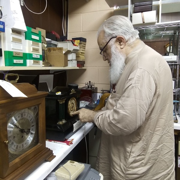 Mr. Farooqui the old & wise clocksmith at work - Photos of Our Business -  The Time Center