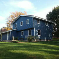 External shot showing new windows and siding installed on home in West Bend Wisconsin 