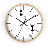 The Crazy Cats Clock from Jade and Jemina features a playful and whimsical design with colorful, quirky cat illustrations.