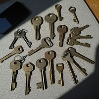 Collection of vintage brass skeleton keys laid out flat by First Locksmiths. Call Us (845) 506-8280