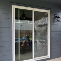 After — residential patio sliding door glass replaced by Clear Works.